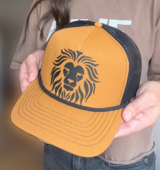 Lion Head on Caramel and Black Trucker Hat with with black bill rope