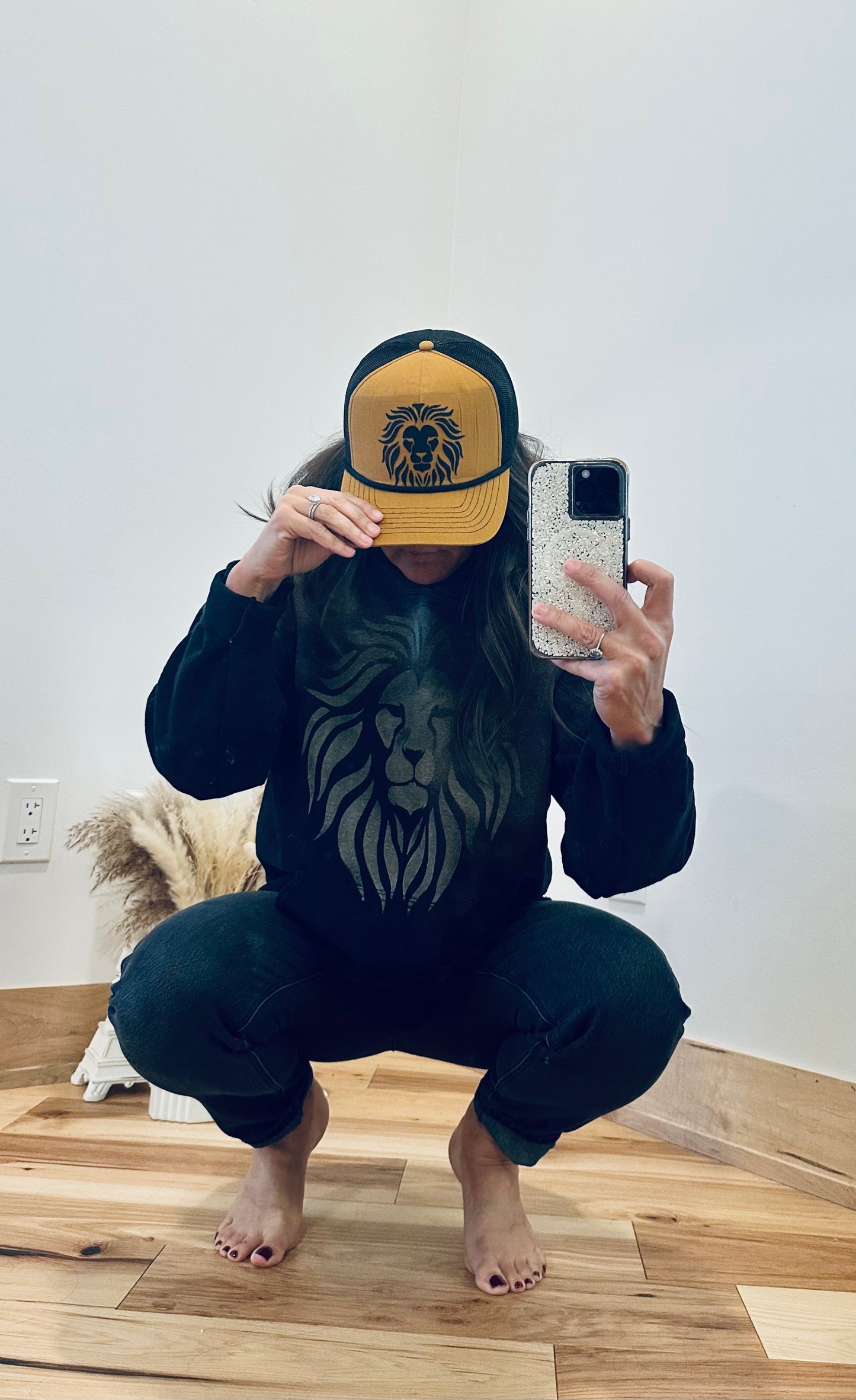 Lion Head on Caramel and Black Trucker Hat with with black bill rope